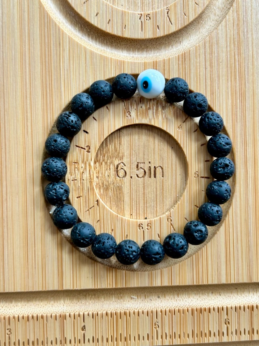 Black Lava Bead Bracelet with Blue Eye Accent